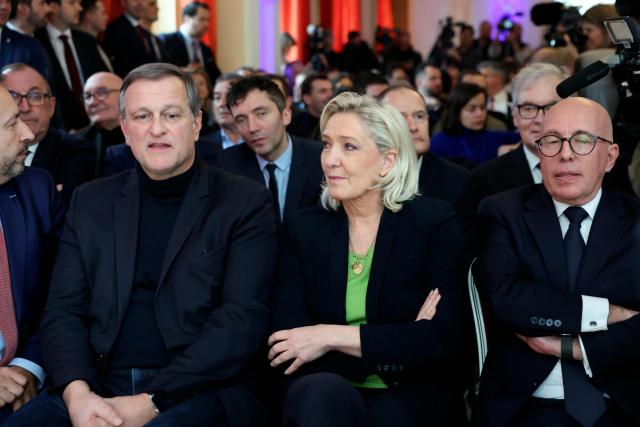 (From L) Perpignan's mayor Louis Aliot, President of Rassemblement National parliamentary group Marine Le Pen and President of UDR parliamentary group Eric Ciotti listen to the President of French far-right Rassemblement National (RN) party and Member of the European Parliament (MEP) Jordan Bardella delivering his New Year wishes to the press at the Maison de l'Amérique Latine in Paris, on January 12, 2026. (Photo by Alain JOCARD / AFP)