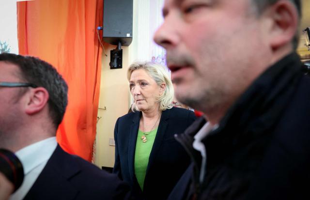 President of Rassemblement National parliamentary group Marine Le Pen leaves after the presentation of New Year's wishes to the press by the President of French far-right Rassemblement National (RN) party and Member of the European Parliament (MEP) Jordan Bardella at the Maison de l'Amérique Latine in Paris, on January 12, 2026. (Photo by Alain JOCARD / AFP)