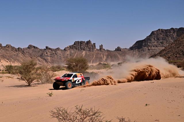 Toyota Gazoo Racing W2RC’s South African driver Henk Lategan and South African co-pilot Brett Cummings compete in Stage 8 of the 48th edition of the Dakar Rally 2026, between Wadi ad-Dawasir and Wadi ad-Dawasir in Saudi Arabia on January 12, 2026. (Photo by Giuseppe CACACE / AFP)