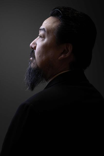 Chinese artist Son Dong, a major figure in contemporary Chinese art, poses during a photo session at Le Bon Marche department store in Paris on January 12, 2026. (Photo by Joel Saget / AFP)