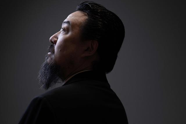 Chinese artist Son Dong, a major figure in contemporary Chinese art, poses during a photo session at Le Bon Marche department store in Paris on January 12, 2026. (Photo by JOEL SAGET / AFP)