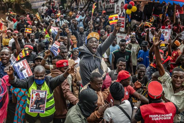 Supporters of opposition leader and presidential candidate for the National Unity Platform (NUP) Robert Kyagulanyi Ssentamu, popularly known as Bobi Wine, celebrate his arrival at the party’s final campaign rally ahead of the 2026 general elections in Kampala on January 12, 2026. (Photo by Luis TATO / AFP)