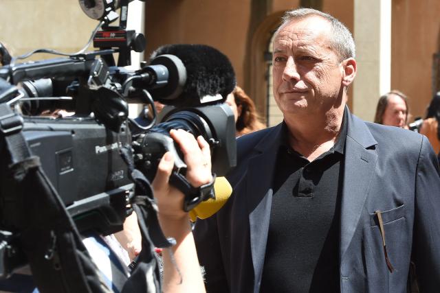 (FILES) Former president of Ajaccio's football Club Alain Orsoni, father of Guy Orsoni, arrives for his trial at the courthouse of Aix-en-Provence on May 11, 2015. Alain Orsoni, a former Corsican nationalist leader turned businessman and former head of the AC Ajaccio football club, was shot dead during his mother's funeral on January 12, 2026, in the village of Vero, southern Corsica, according to a source close to the investigation. (Photo by BORIS HORVAT / AFP)