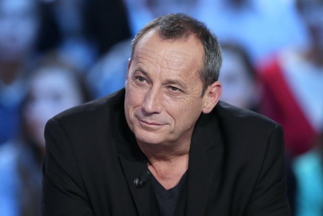 (FILES) Ajaccio's football club president Alain Orsoni takes part in the TV show "Le grand journal" on a set of French TV Canal+, on November 16, 2012 in Paris. Alain Orsoni, a former Corsican nationalist leader turned businessman and former head of the AC Ajaccio football club, was shot dead during his mother's funeral on January 12, 2026, in the village of Vero, southern Corsica, according to a source close to the investigation. (Photo by Kenzo TRIBOUILLARD / AFP)