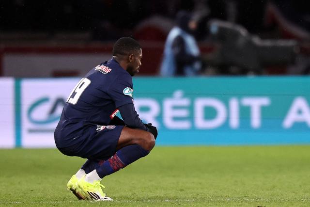 Paris Saint-Germain's French forward #19 Ousmane Dembele reacts after Paris FC's French midfielder #14 Jonathan Ikone his team´s first goal during the French Cup round of 32 football match between between Paris Saint-Germain (PSG) and Paris FC at the Parc des Princes stadium in Paris on January 12, 2026. (Photo by Anne-Christine POUJOULAT / AFP)