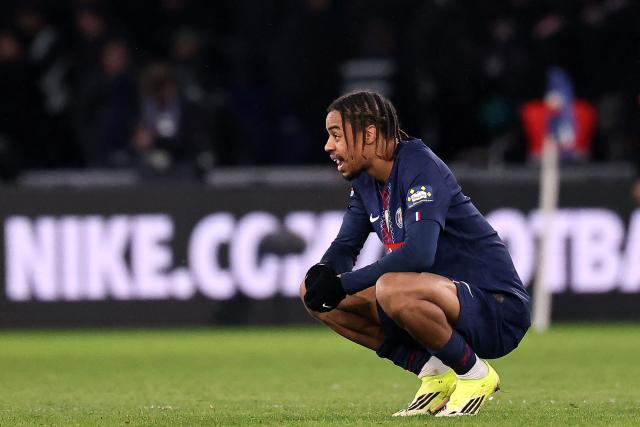 Paris Saint-Germain's French forward #11 Bradley Barcola reacts after losing their French Cup round of 32 football against Paris FC at the Parc des Princes stadium in Paris on January 12, 2026. (Photo by Anne-Christine POUJOULAT / AFP)