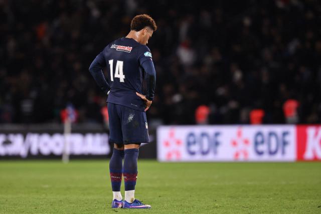 Paris Saint-Germain's French midfielder #14 Desire Doue reacts after losing their French Cup round of 32 football against Paris FC at the Parc des Princes stadium in Paris on January 12, 2026. (Photo by Anne-Christine POUJOULAT / AFP)