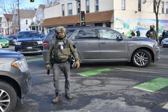 US Customs and Border Protection agents patrol while looking to detain undocumented persons during immigration enforcement activity in Minneapolis, Minnesota, on January 12, 2026. Hundreds more federal agents were heading to Minneapolis, the US homeland security chief said on January 11, brushing aside demands by the Midwestern city's Democratic leaders to leave after an immigration officer fatally shot a woman protester. In multiple TV interviews, US Homeland Secretary Kristi Noem defended the actions of the officer who shot and killed 37-year-old Renee Nicole Good, whose death has sparked renewed protests nationwide against President Donald Trump's immigration crackdown. (Photo by Octavio JONES / AFP)