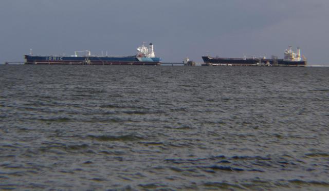 Crude oil tankers are pictured at Maracaibo Lake in Maracaibo, Venezuela on January 12, 2026. After the US raid that deposed Nicolas Maduro as Venezuela's leader, citizens hope the ensuing talks on selling its oil to US may improve their dire economic fortunes. (Photo by Margioni BERMÚDEZ / AFP)