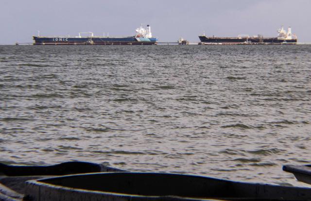 Crude oil tankers are pictured at Maracaibo Lake in Maracaibo, Venezuela on January 12, 2026. After the US raid that deposed Nicolas Maduro as Venezuela's leader, citizens hope the ensuing talks on selling its oil to US may improve their dire economic fortunes. (Photo by Margioni BERMÚDEZ / AFP)