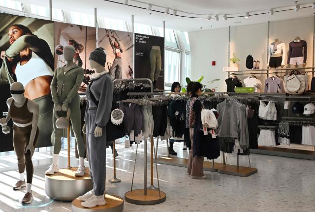 People visit a Lululemon store, a Canadian brand, in Beijing on January 13, 2026. (Photo by Adek BERRY / AFP)