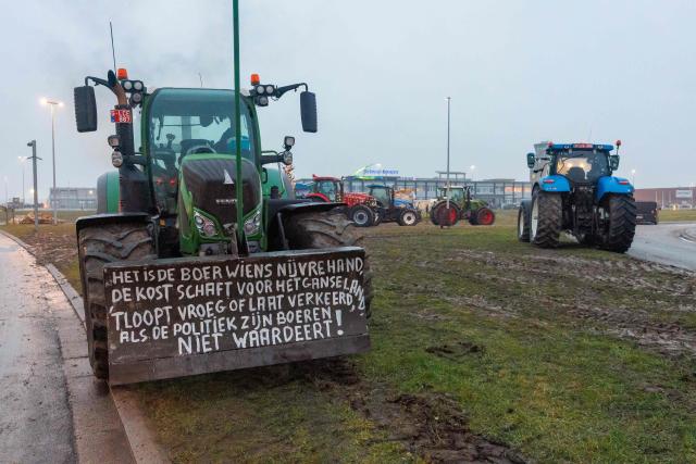Tractors are parked near Ostend airport as unions called farmers to block several strategic traffic junctions with tractors to protest against EU-Mercosur agreements, on January 13, 2026. European Commission head will sign the Mercosur trade deal in Paraguay on January 17, 2026. (Photo by KURT DESPLENTER / Belga / AFP) / Belgium OUT