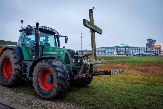 Tractors are parked near Ostend airport as unions called farmers to block several strategic traffic junctions with tractors to protest against EU-Mercosur agreements, on January 13, 2026. European Commission head will sign the Mercosur trade deal in Paraguay on January 17, 2026. (Photo by KURT DESPLENTER / Belga / AFP) / Belgium OUT