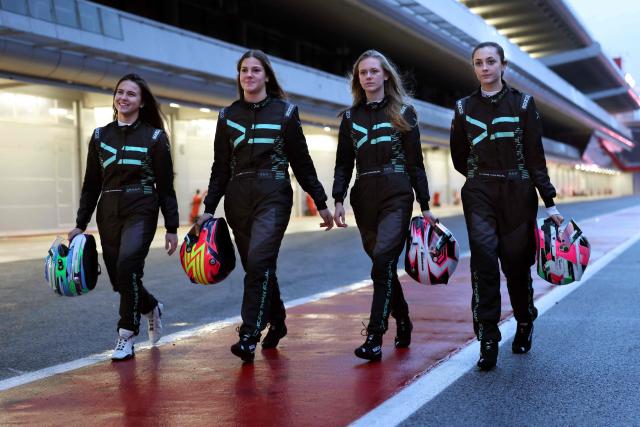 (From L) Austria's Ivonn Simeonova, Romania's Zoe Florescu-Potolea, Sweden's Alexia Danielsson, and Britain's Skye Parker pose during a test training session at the Circuit de Barcelona-Catalunya in Montmelo, Barcelona province, on December 15, 2025. The project of More Than Equal, founded by entrepreneur and philanthropist Karel Komarek and former F1 driver David Coulthard, is simple and fearlessly ambitious: to find and develop the first woman F1 world champion in a male-dominated sport. (Photo by Lluis GENE / AFP)