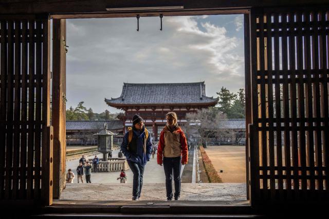 Tourists visit Todaiji Temple in Nara on January 13, 2026. (Photo by Yuichi YAMAZAKI / AFP)