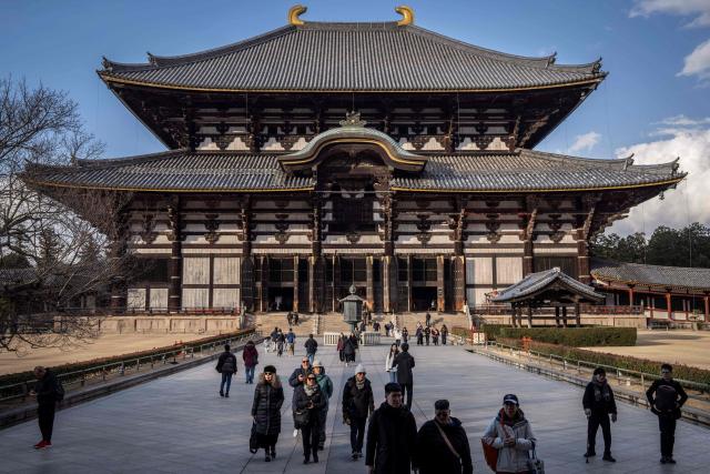 Tourists visit Todaiji Temple in Nara on January 13, 2026. (Photo by Yuichi YAMAZAKI / AFP)