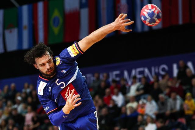 (FILES) France's centre back #05 Nedim Remili shoots during the Preliminary Round Group C match between France and Qatar of the IHF Men's Handball World Championship at the Zatika Sport Centre in Porec, on January 14, 2025. Nedim Remili, centre back for the French handball team, is forfeit for the Men's EHF Euro 2026 European Handball Championship (January 15 - February 1) due to an injury to his left calf, the French Handball Federation announced on January 13, 2026. (Photo by Anne-Christine POUJOULAT / AFP)