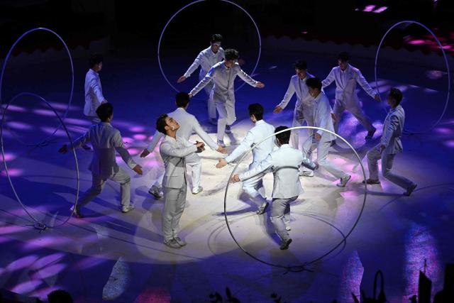 Acrobats of the Chinese National Acrobatic Troupe perform with hoops on stage of the Capital Grand Circus during the gala of the 16th Budapest International Circus Festival in Budapest, Hungary, on January 12, 2026. The Chinese team presented the best performance of the festival. (Photo by Attila KISBENEDEK / AFP)