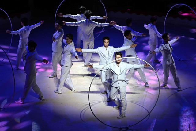 Acrobats of the Chinese National Acrobatic Troupe perform with hoops on stage of the Capital Grand Circus during the gala of the 16th Budapest International Circus Festival in Budapest, Hungary, on January 12, 2026. The Chinese team presented the best performance of the festival. (Photo by Attila KISBENEDEK / AFP)