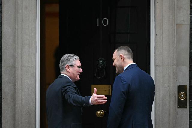 Britain's Prime Minister Keir Starmer greets Poland's President Karol Nawrocki outside of 10 Downing Street in central London on January 13, 2026. (Photo by JUSTIN TALLIS / AFP)