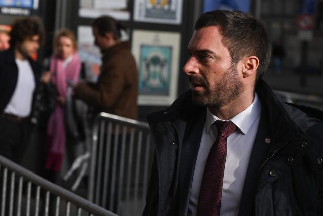 MP for the French far-right party Rassemblement National (RN) Julien Odul arrives for the appeal trial of RN's members on suspicion of embezzlement of European public funds, at Paris courthouse, on January 13, 2026. The appeal comes after a court last year barred the President of the RN parliamentary group Marine Le Pen from running for office for five years over a European Parliament fake-jobs scam involving her and other officials from her National Rally party. The hearing is expected to run until February 11, 2026, with a decision expected this summer.  Twelve of the accused, as well as the far-right party itself, have appealed against the verdict while another 12 people -- including one of Le Pen's sisters -- have decided to accept their convictions without appealing. (Photo by Martin LELIEVRE / AFP)