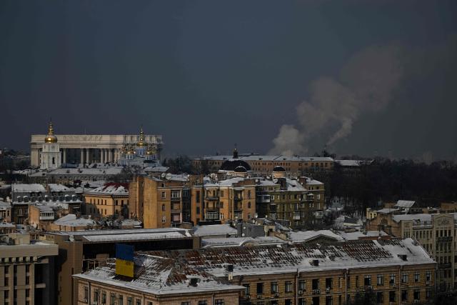 This photograph taken on January 13, 2026 shows buildings in central Kyiv, among them the Ukrainian Ministry of Foreign Affairs and St. Michael's Golden-Domed Monastery (R), with steam rising from chimneys in the background, amid the Russian invasion of Ukraine. (Photo by Sergei GAPON / AFP)