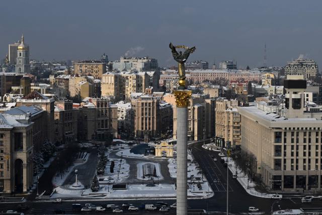 ?ars drive along the Independence Square in Kyiv on January 13, 2026, amid the Russian invasion of Ukraine. (Photo by Sergei GAPON / AFP)