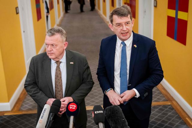 Danish Defense Minister Troels Lund Poulsen (R) and Danish Foreign Minister Lars Loekke Rasmussen hold a doorstep after a meeting with the Parliamentary Foreign Policy Committee at Christiansborg in Copenhagen, Denmark, on January 13, 2026. (Photo by Sebastian Elias Uth / Ritzau Scanpix / AFP) / Denmark OUT
