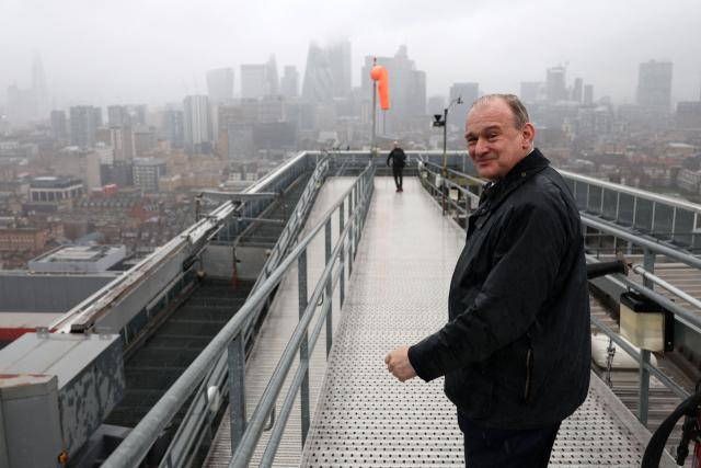 Britain's Liberal Democrat party leader Ed Davey walks off the helipad at the Royal London Hospital in east London on January 13, 2026, following a visit to the London Air Ambulance. (Photo by Adrian DENNIS / AFP)