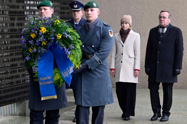 German Defence Minister Boris Pistorius (R) and the European Union's High Representative for Foreign Affairs and Security Policy Kaja Kallas (2nd R) lay a wreath at the memorial of the German armed forces Bundeswehr dedicated to the Bundeswehr members who lost their lives in the line of duty, at the defence ministry in Berlin, during their meeting on January 13, 2026. (Photo by John MACDOUGALL / AFP)