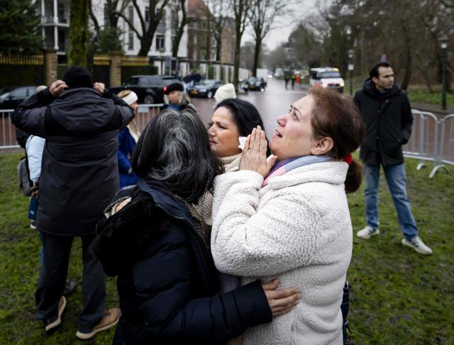 Protesters react during a demonstration outside the Iranian Embassy in The Hague, on January 13, 2026. A violent crackdown on a wave of protests in Iran has killed at least 648 people, Norway-based NGO Iran Human Rights (IHR) said on January  12, as Iranian authorities sought to regain control of the streets with mass nationwide rallies. The demonstrations moved from protesting economic grievances to demanding a wholesale change from the clerical system that has ruled Iran since the 1979 revolution that ousted the shah. (Photo by Sem van der Wal / ANP / AFP) / Netherlands OUT