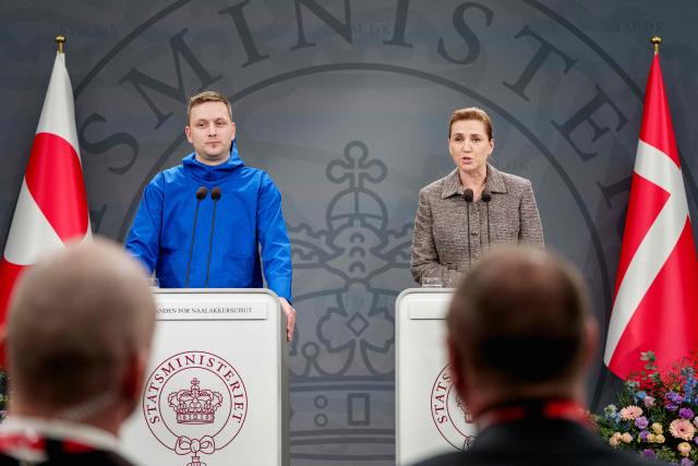 Greenland's Head of Government (Naalakkersuisut) Jens-Frederik Nielsen (L) and Denmark's Prime Minister Mette Frederiksen give a statement in the Mirror Hall at the Prime Minister's Office in Copenhagen, Denmark, on January 13, 2026. Nielsen said that the autonomous territory of Greenland would choose to remain Danish rather than become part of the United States, following US President Donald Trump's threats to take over the Arctic island. Frederiksen meanwhile said it had not been easy to stand up to what she slammed as "completely unacceptable pressure from our closest ally". (Photo by Liselotte Sabroe / Ritzau Scanpix / AFP) / Denmark OUT