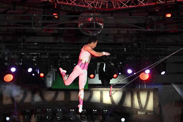 Argentine and American acrobats, members of the 'Flying Tabares' group, perform on air at the Capital Grand Circus during the awarding ceremony of the 16th Budapest International Circus Festival in Budapest, Hungary, on January 12, 2026. This  festival is the second-largest professional circus arts event globally, ranking just behind the International Circus Festival of Monte-Carlo. (Photo by Attila KISBENEDEK / AFP)