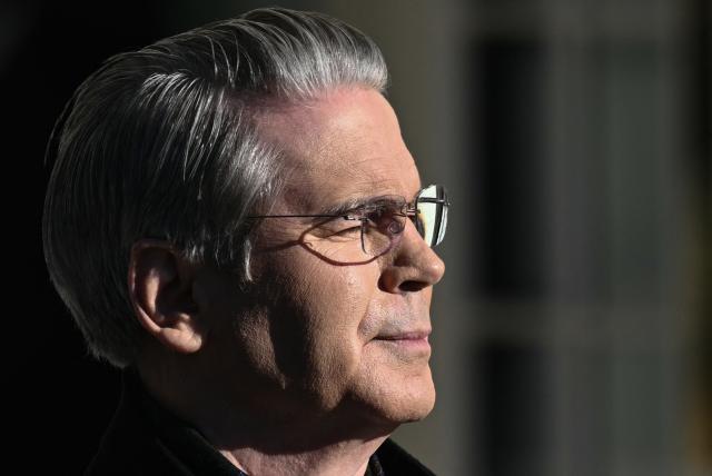 US Secretary of Treasury Scott Bessent waits for US President Donald Trump before they walk to board Marine One upon departure from the South Lawn of the White House in Washington, DC, on January 13, 2026. Trump is travelling to Detroit, Michigan to speak to The Detroit Economic Club and visit a Ford production plant. (Photo by Brendan SMIALOWSKI / AFP)