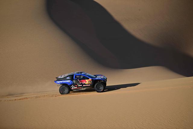 Ford Racing’s Swedish driver Mattias Ekstr0m and Swedish co-pilot Emil Bergkvist compete in Stage 9, a marathon stage, of the 48th edition of the Dakar Rally 2026, between Wadi ad-Dawasir and Bisha, Saudi Arabia, on January 13, 2026. (Photo by Giuseppe CACACE / AFP)