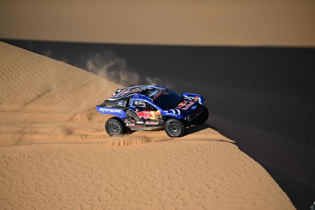 Ford Racing’s Swedish driver Mattias Ekstrom and Swedish co-pilot Emil Bergkvist compete in Stage 9, a marathon stage, of the 48th edition of the Dakar Rally 2026, between Wadi ad-Dawasir and Bisha, Saudi Arabia, on January 13, 2026. (Photo by Giuseppe CACACE / AFP)
