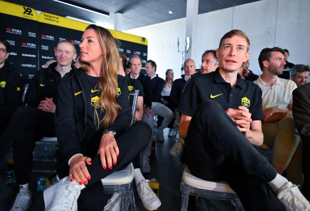 Visma-Lease a bike's Danish rider Jonas Vingegaard (R) and Visma-Lease a bike's French rider Pauline Ferrand-Prevot look on before a press conference during the presentation of the Visma-Lease a Bike cycling team at La Nucia near Alicante, eastern Spain on January 13, 2026. (Photo by Jose Jordan / AFP)