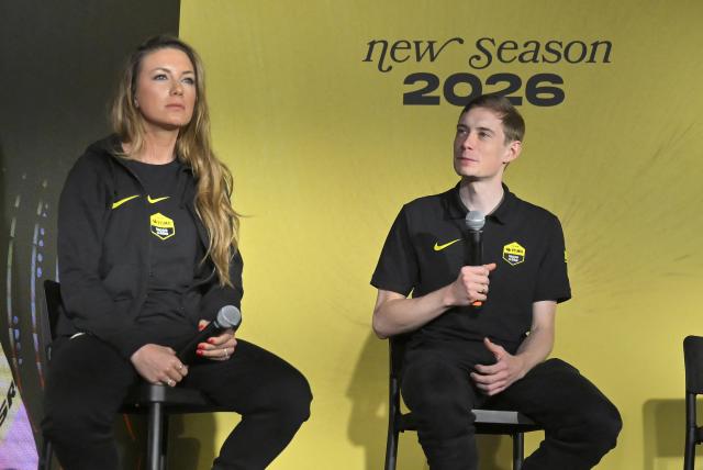 Visma-Lease a bike's Danish rider Jonas Vingegaard (R) and Visma-Lease a bike's French rider Pauline Ferrand-Prevot attend a press conference during the presentation of the Visma-Lease a Bike cycling team at La Nucia near Alicante, eastern Spain on January 13, 2026. (Photo by Jose Jordan / AFP)