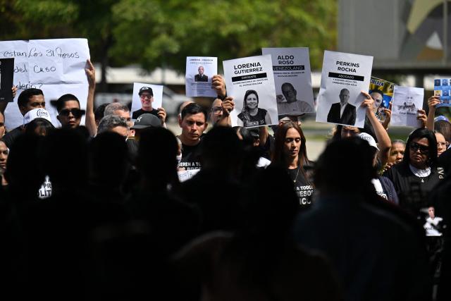 Relatives hold portraits of political prisoners during a demonstration by relatives at the Central University of Venezuela in Caracas on January 13, 2026. Venezuela said on January 12, it had freed dozens more political prisoners as rights groups questioned the numbers and family members clamored for speedier releases after the US military ouster of long-term autocrat Nicolas Maduro. (Photo by Juan BARRETO / AFP)