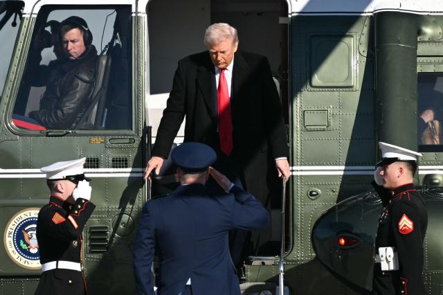 US President Donald Trump steps off Marine One as he arrives to board Air Force One at Joint Base Andrews, Maryland on January 13, 2026, as he travels to Detroit, Michigan. (Photo by Mandel NGAN / AFP)