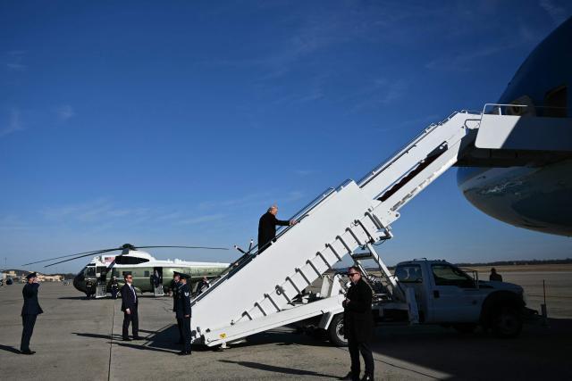 US President Donald Trump boards Air Force One at Joint Base Andrews, Maryland on January 13, 2026, as he travels to Detroit, Michigan. (Photo by Mandel NGAN / AFP)