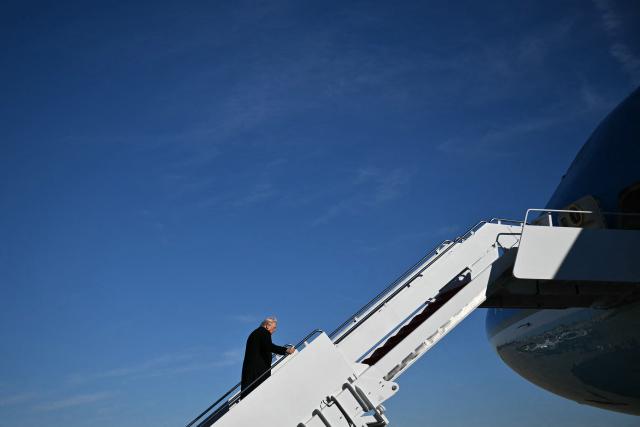 TOPSHOT - US President Donald Trump boards Air Force One at Joint Base Andrews, Maryland on January 13, 2026, as he travels to Detroit, Michigan. (Photo by Mandel NGAN / AFP)