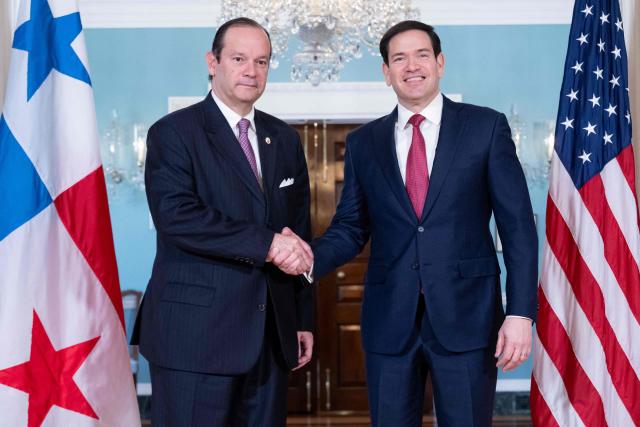 US Secretary of State Marco Rubio greets Panamanian Foreign Minister Javier Martínez-Acha (L) prior to meetings at the State Department in Washington, DC, January 13, 2026. (Photo by SAUL LOEB / AFP)