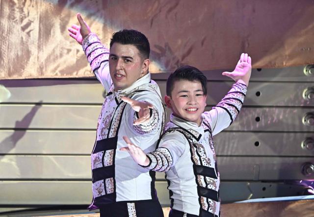Gold trophy winner Columbian and Japanese acrobats, members of the 'Martinez Brothers', perform at the 16th Budapest International Circus Festival on stage of the Capital Grand Circus in Budapest during the awarding ceremony of the festival in Budapest, on January 12, 2026. This  festival is the second-largest professional circus arts event globally, ranking just behind the International Circus Festival of Monte-Carlo. (Photo by Attila KISBENEDEK / AFP)