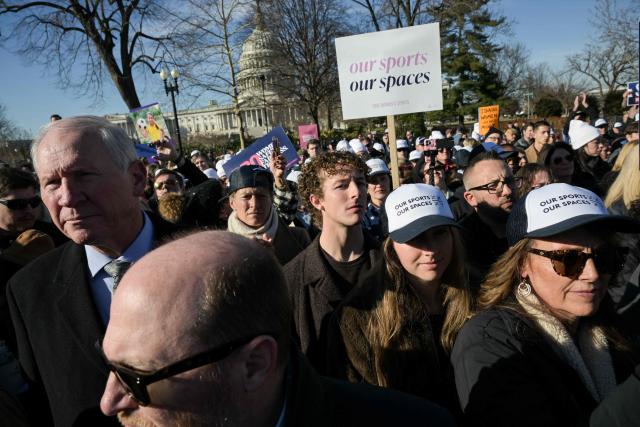Demonstrators supporting restrictions on transgender athletes gather outside US Supreme Court as justices hear arguments in challenges to state bans on transgender girls and women in sports, in Washington, DC, on January 13, 2026. The US Supreme Court on January 13 wades into the hot-button issue of transgender athletes in girls' and women's sports. The conservative-dominated court is to hear challenges to state laws in Idaho and West Virginia banning transgender athletes from female competition. More than two dozen US states have passed laws in recent years barring athletes who were assigned as male at birth from taking part in girls' or women's sports. (Photo by Oliver Contreras / AFP)