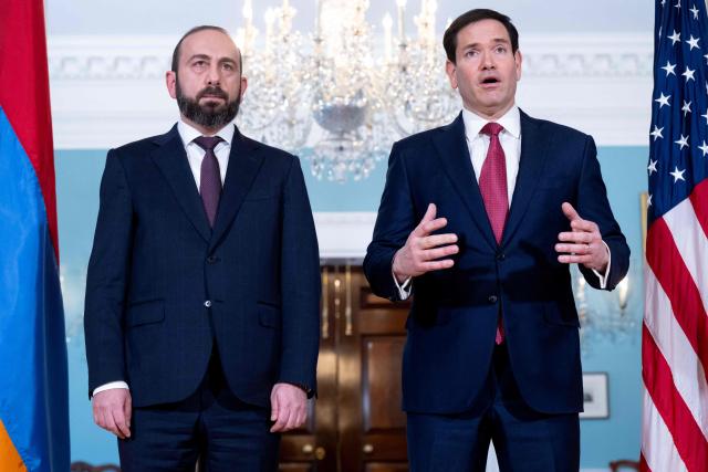 US Secretary of State Marco Rubio speaks to the press as he greets Armenian Foreign Minister Ararat Mirzoyan (L) prior to meetings at the State Department in Washington, DC, on January 13, 2026. (Photo by SAUL LOEB / AFP)