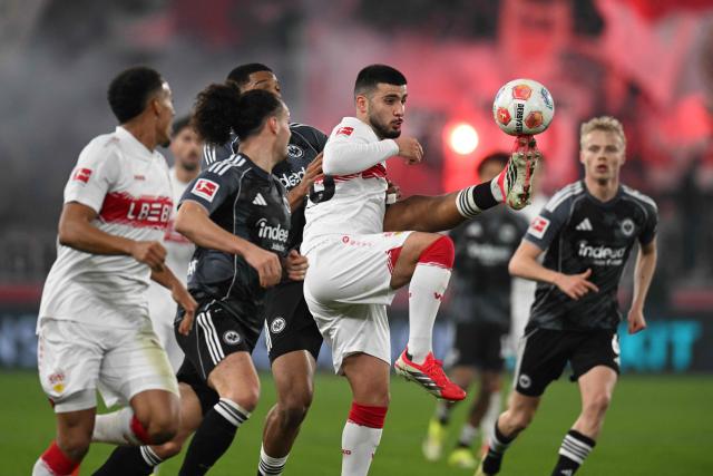 Frankfurt's Swiss-Cameroonian defender #05 Aurele Amenda (Back) vies for the ball with Stuttgart's German forward #26 Deniz Undav during the German first division Bundesliga football match between VfB Stuttgart and Eintracht Frankfurt in Stuttgart, southern Germany, on January 13, 2026. (Photo by THOMAS KIENZLE / AFP) / DFL REGULATIONS PROHIBIT ANY USE OF PHOTOGRAPHS AS IMAGE SEQUENCES AND/OR QUASI-VIDEO