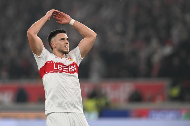 Stuttgart's Bosnian forward #09 Ermedin Demirovic celebrates after scoring the equalising goal 1:1 during the German first division Bundesliga football match between VfB Stuttgart and Eintracht Frankfurt in Stuttgart, southern Germany, on January 13, 2026. (Photo by THOMAS KIENZLE / AFP) / DFL REGULATIONS PROHIBIT ANY USE OF PHOTOGRAPHS AS IMAGE SEQUENCES AND/OR QUASI-VIDEO