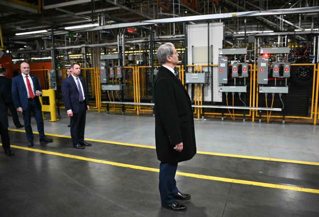 US Treasury Secretary Scott Bessent looks on as President Donald Trump tours Ford Motor Company's River Rouge complex in Dearborn, Michigan, on January 13, 2026. (Photo by Mandel NGAN / AFP)