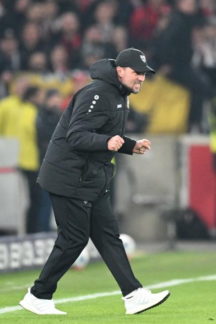 Stuttgart's German head coach Sebastian Hoeness celebrates after the German first division Bundesliga football match between VfB Stuttgart and Eintracht Frankfurt in Stuttgart, southern Germany, on January 13, 2026. (Photo by THOMAS KIENZLE / AFP) / DFL REGULATIONS PROHIBIT ANY USE OF PHOTOGRAPHS AS IMAGE SEQUENCES AND/OR QUASI-VIDEO
